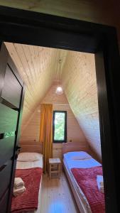 Postel nebo postele na pokoji v ubytování Garden House Mestia + 37 fotografií