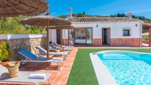 a villa with a swimming pool and a house at Alma del Tejar Antequera La Higuera by Ruralidays in Antequera
