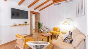 a living room with a couch and a table at Alma del Tejar Antequera La Higuera by Ruralidays in Antequera