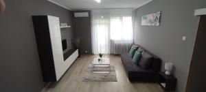 Posezení v ubytování Grey Deluxe Apartman Kaposvár