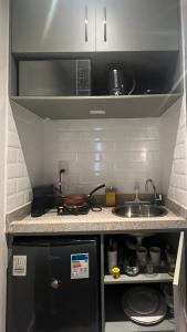 Kjøkken eller kjøkkenkrok på América apart-hotel