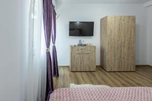 TV a/nebo společenská místnost v ubytování Casa Lya