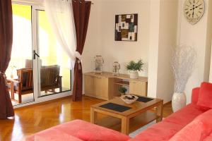 a living room with a couch and a table at Villa Luka in Pag