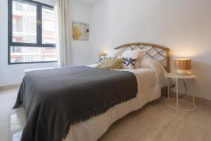 Postel nebo postele na pokoji v ubytování Apartamento Amelia Campello