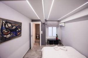 Postel nebo postele na pokoji v ubytování Exclusive New Modern Apartment at Syntagma Square