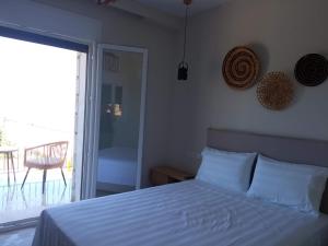 Posteľ alebo postele v izbe v ubytovaní Zephyros Villas - Agios Nikitas
