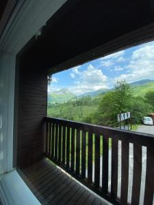 a balcony with a view of the mountains at Hotel Pod Sokolím in Terchová