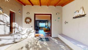 a hallway of a house with a living room at Panorama Villa Sea view in Selianitika