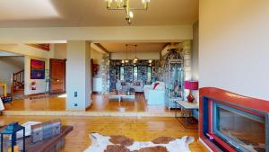 a large living room with a fireplace and a living room at Panorama Villa Sea view in Selianitika