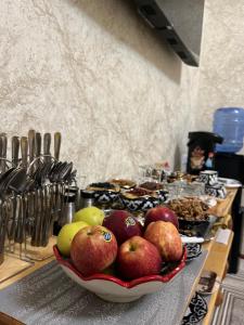 a bowl of fruit on a counter in a kitchen at SAID-MAXSUM in Khiva