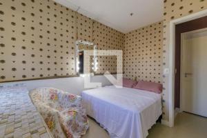 Tempat tidur dalam kamar di Apartamento Top Barra da tijuca