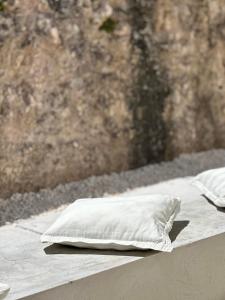 a white pillow sitting on top of a bed at Petra Maris B&B in Peschici