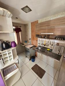 an overhead view of a kitchen with a counter top at Apartamento Cantinho na Praia in Ilhéus
