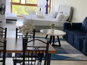 a living room with a couch and a table at Julia Ocean View Villa in Ukunda