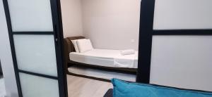 JQ 合一民宿3 Unity Homestay 3 NEW 5pax Netflix Cinema客房内的一张或多张床位