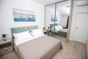 Postel nebo postele na pokoji v ubytování Apartman KATARINA