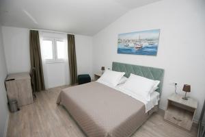 Postel nebo postele na pokoji v ubytování Apartman KATARINA