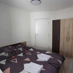Postel nebo postele na pokoji v ubytování Alek Apartman