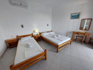 Postel nebo postele na pokoji v ubytování ΕΙΡΗΝΗ Studios