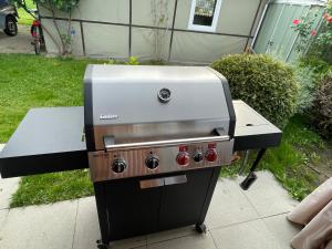a grill sitting on top of a patio at Campingwohnung am Silbersee in Freiburg in Freiburg im Breisgau +11 photos