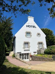 a white building with the word hotel on it at Hôtel An Ti Gwenn in Carnac