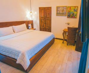 Postel nebo postele na pokoji v ubytování Hotel Boutique Casa Altamira