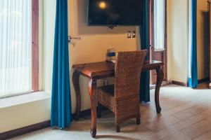 TV a/nebo společenská místnost v ubytování Hotel Boutique Casa Altamira