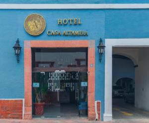 a blue building with a hotel sign on it at Hotel Boutique Casa Altamira in Querétaro