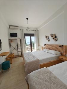 Postel nebo postele na pokoji v ubytování Anthoula House Sarti