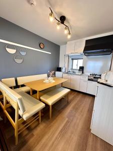 a kitchen and dining room with a table and chairs at Kin-Con-Kan - Vacation STAY 05378v in Nanjo
