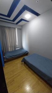 Ένα ή περισσότερα κρεβάτια σε δωμάτιο στο Apartment on Rustaveli