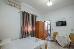 TV a/nebo společenská místnost v ubytování Hotel Vila Vilson