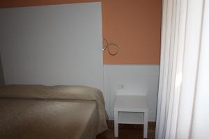 Postel nebo postele na pokoji v ubytování Affittacamere Via Mazzini
