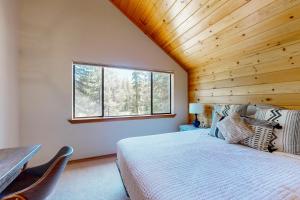 Postel nebo postele na pokoji v ubytování Snowpeak Oasis