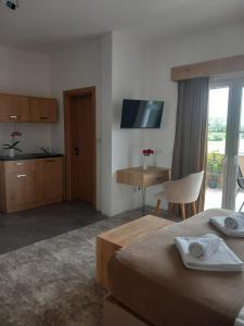 a hotel room with a bed and a table and a desk at Haus Carla in Ulcinj