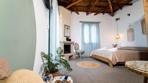 Ένα ή περισσότερα κρεβάτια σε δωμάτιο στο Lithoessa