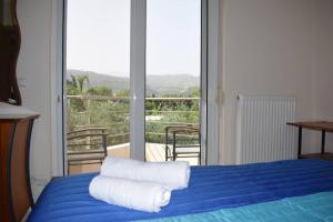 Posteľ alebo postele v izbe v ubytovaní ILIAS VILLA IN CHANIA