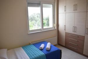 Posteľ alebo postele v izbe v ubytovaní ILIAS VILLA IN CHANIA
