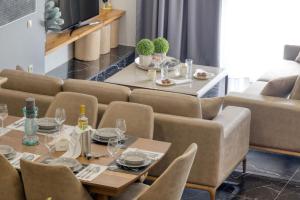 a dining room with a table and chairs at Villa Hope in Chania in Mourniaí