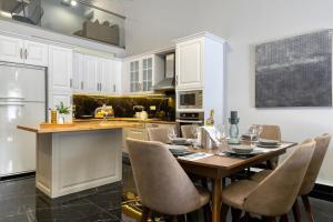 a kitchen with a table and chairs in a room at Villa Hope in Chania in Mourniaí