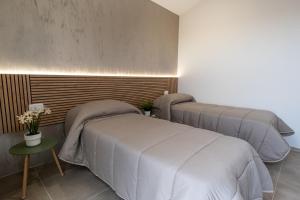 Postel nebo postele na pokoji v ubytování Vilè Home - Intera Villa