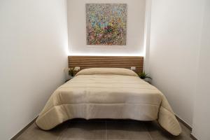 Postel nebo postele na pokoji v ubytování Vilè Home - Intera Villa