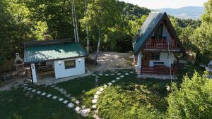 an aerial view of a small house in the woods at Positive vibes in Visoko