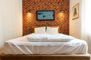 Postel nebo postele na pokoji v ubytování Gramofon INN