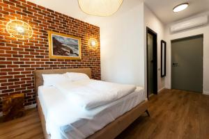 Postel nebo postele na pokoji v ubytování Gramofon INN