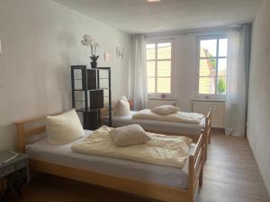 Postel nebo postele na pokoji v ubytování Pension Wunderbar