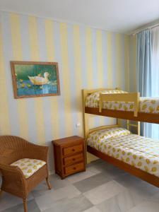 Giường trong phòng chung tại Relax&Sunset Appartement Costa Ballena +51 ảnh