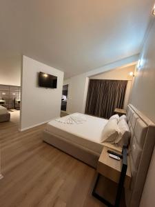 Postel nebo postele na pokoji v ubytování Hotel Noel