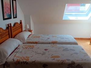 Łóżko lub łóżka w pokoju w obiekcie Pension Doña Lubina