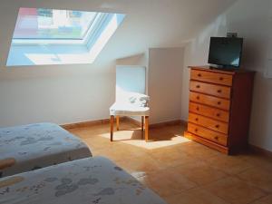 Łóżko lub łóżka w pokoju w obiekcie Pension Doña Lubina